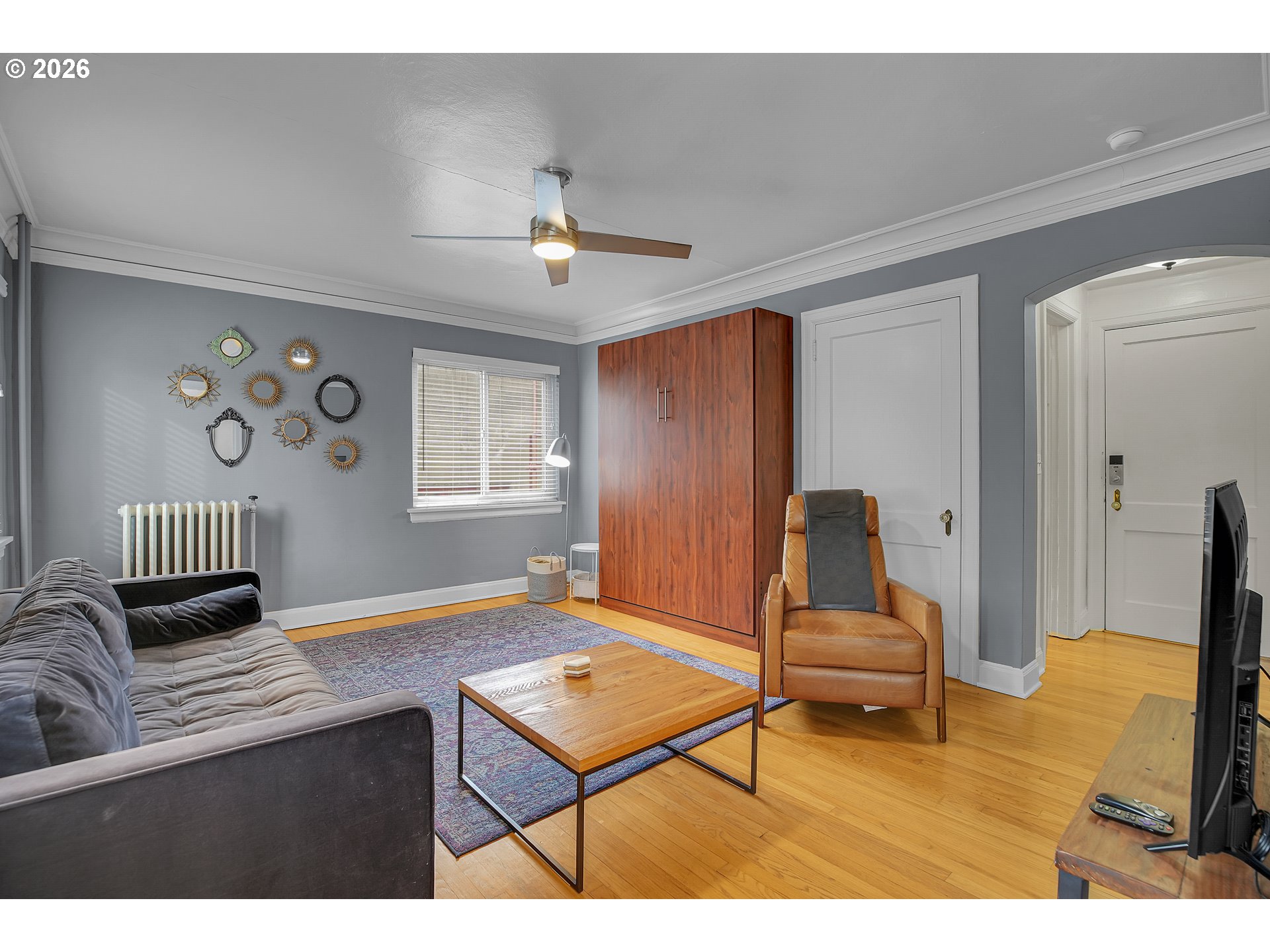 709 Southwest 16th Avenue, Unit 207 Portland, OR 97205 - Photo 21 of 47 a living room with furniture and a flat screen tv