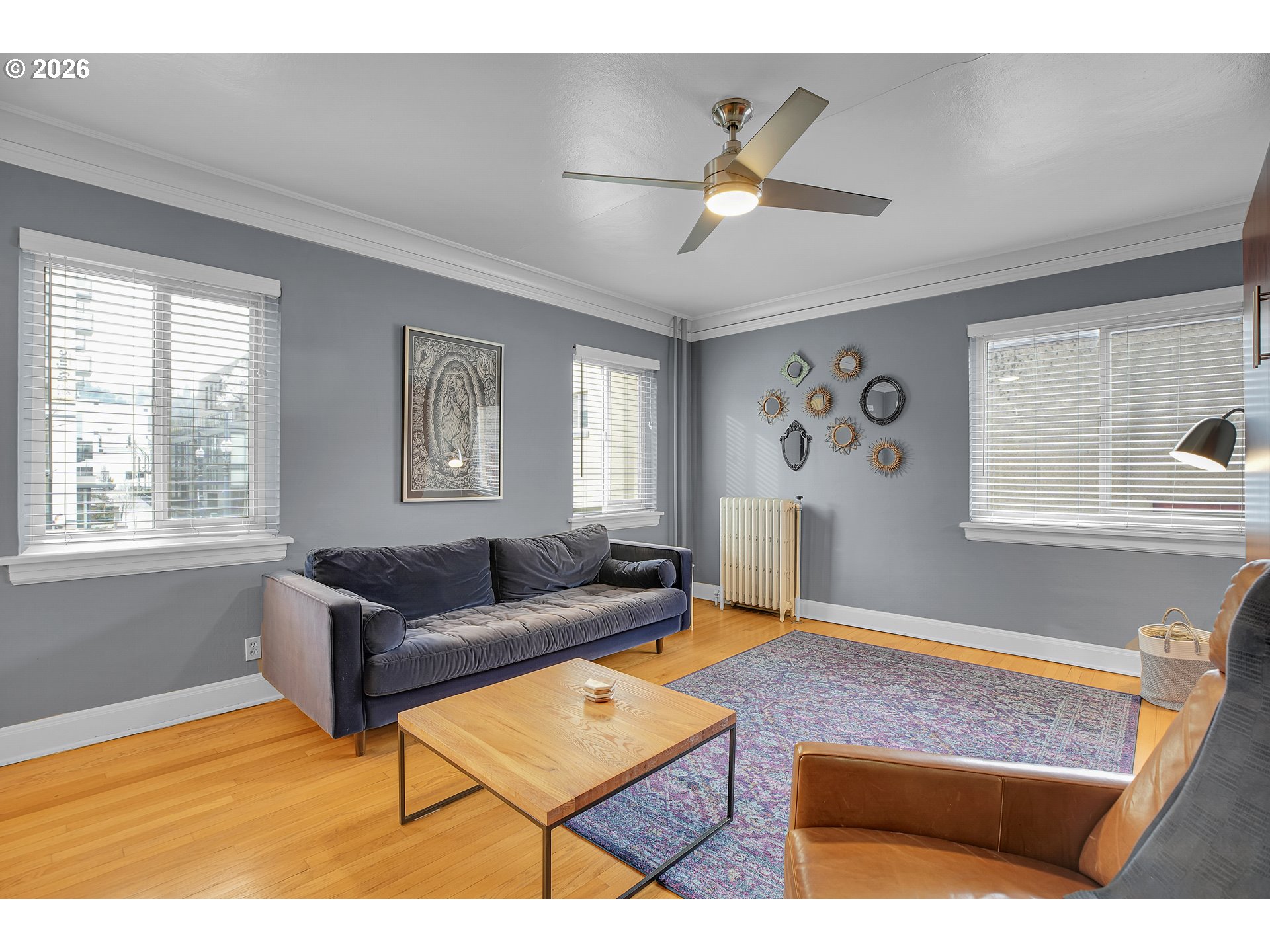709 Southwest 16th Avenue, Unit 207 Portland, OR 97205 - Photo 22 of 47 a living room with furniture and window