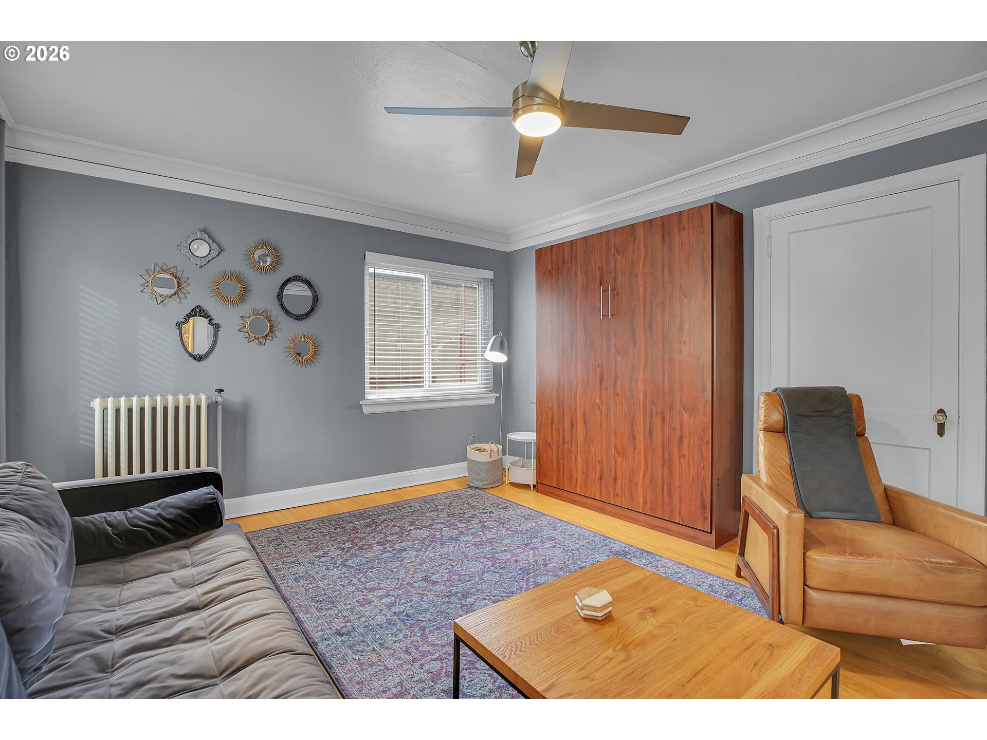 709 Southwest 16th Avenue, Unit 207 Portland, OR 97205 - Photo 23 of 47 a living room with furniture and a window