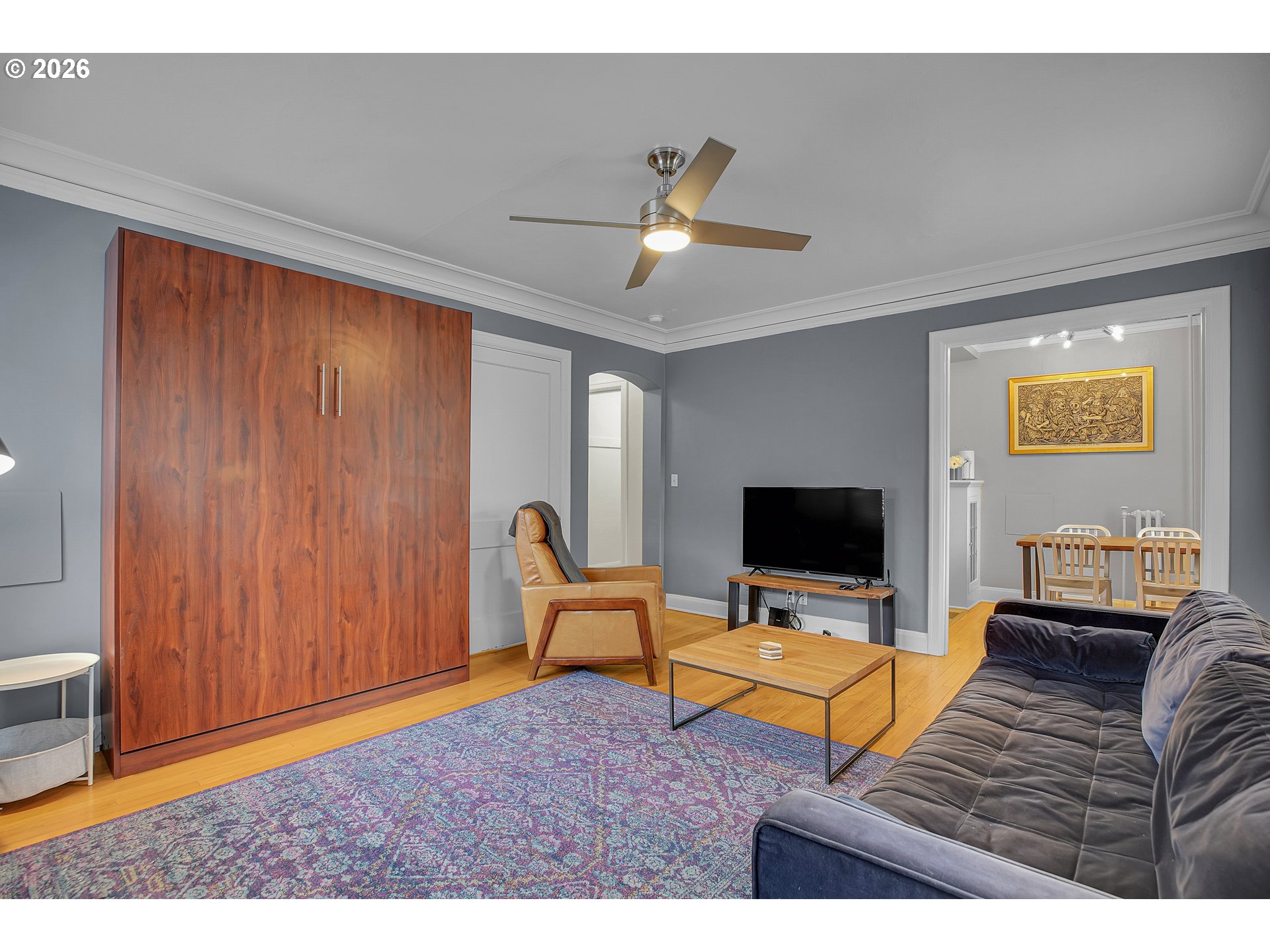 709 Southwest 16th Avenue, Unit 207 Portland, OR 97205 - Photo 24 of 47 a living room with furniture and a flat screen tv
