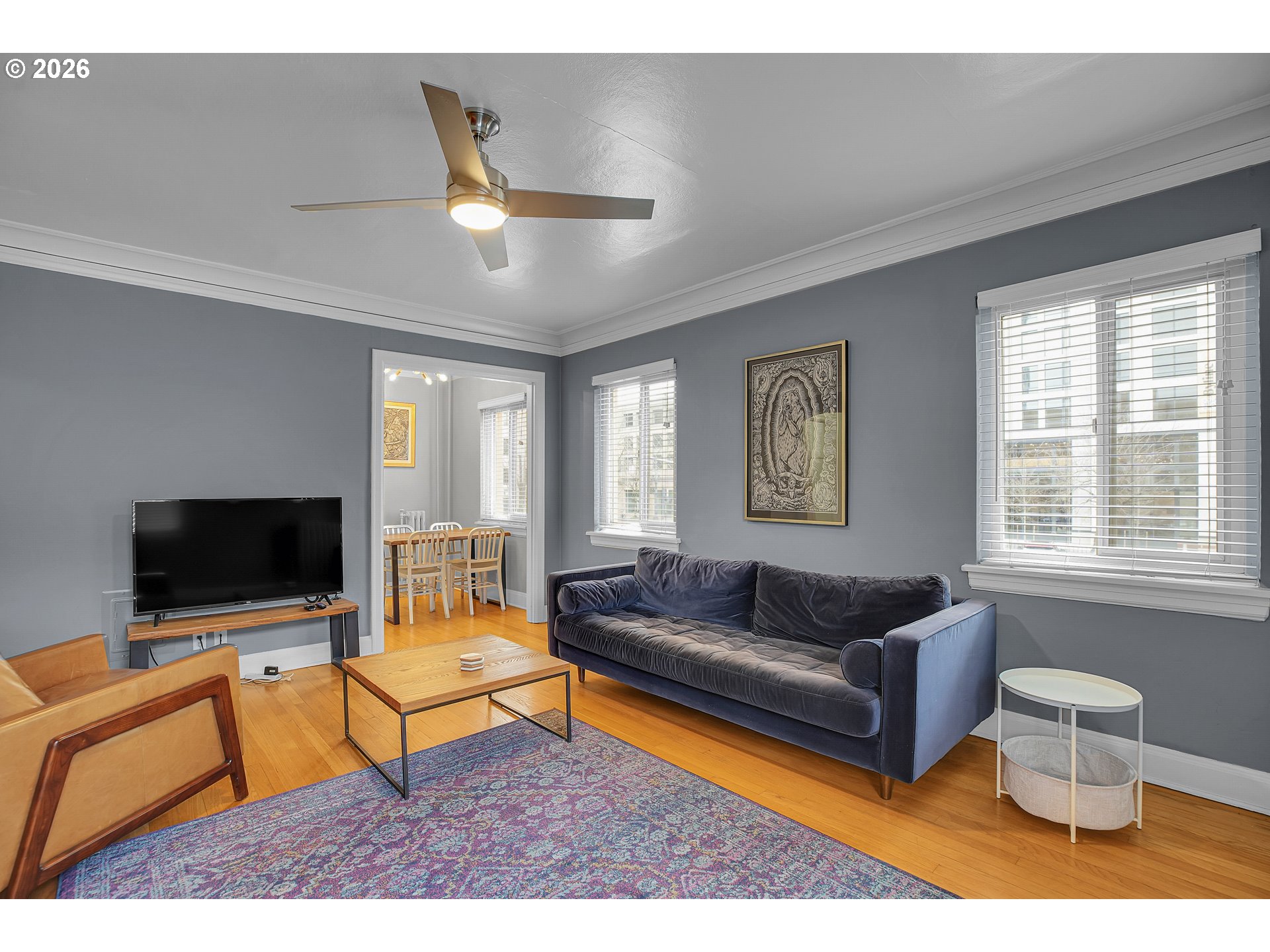 709 Southwest 16th Avenue, Unit 207 Portland, OR 97205 - Photo 25 of 47 a living room with furniture and a flat screen tv