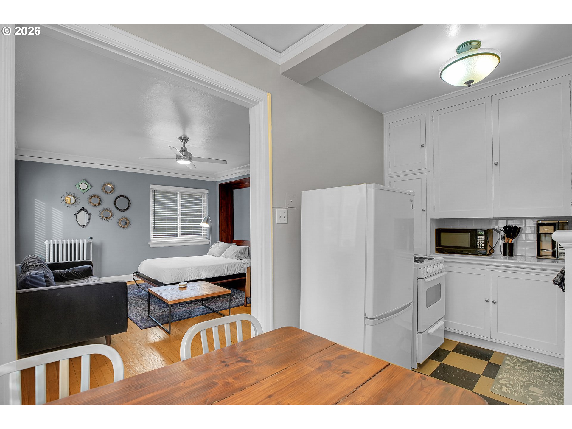 709 Southwest 16th Avenue, Unit 207 Portland, OR 97205 - Photo 28 of 47 a kitchen with a refrigerator and a stove top oven