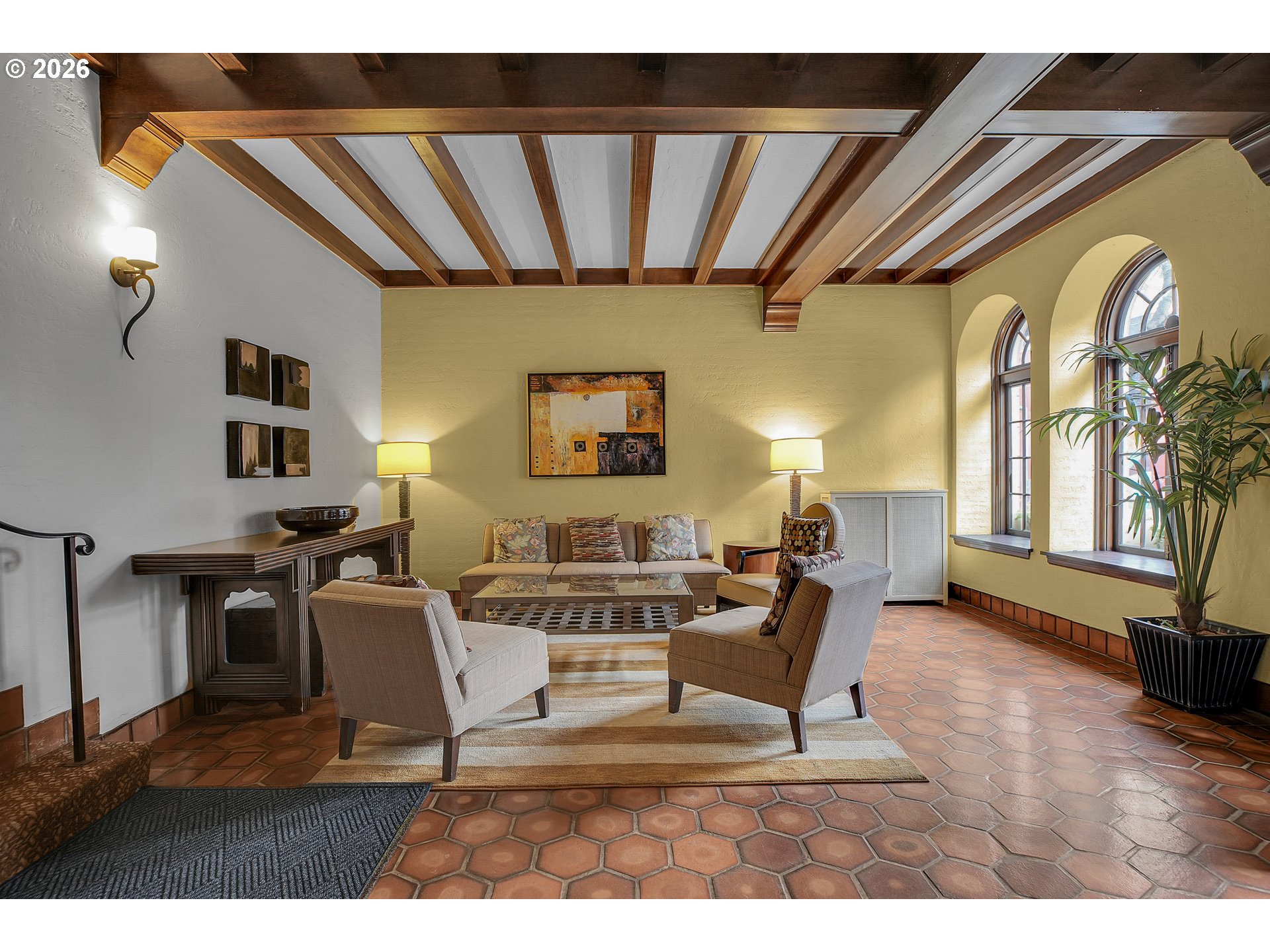 709 Southwest 16th Avenue, Unit 207 Portland, OR 97205 - Photo 7 of 47 a living room with furniture and a wooden floor