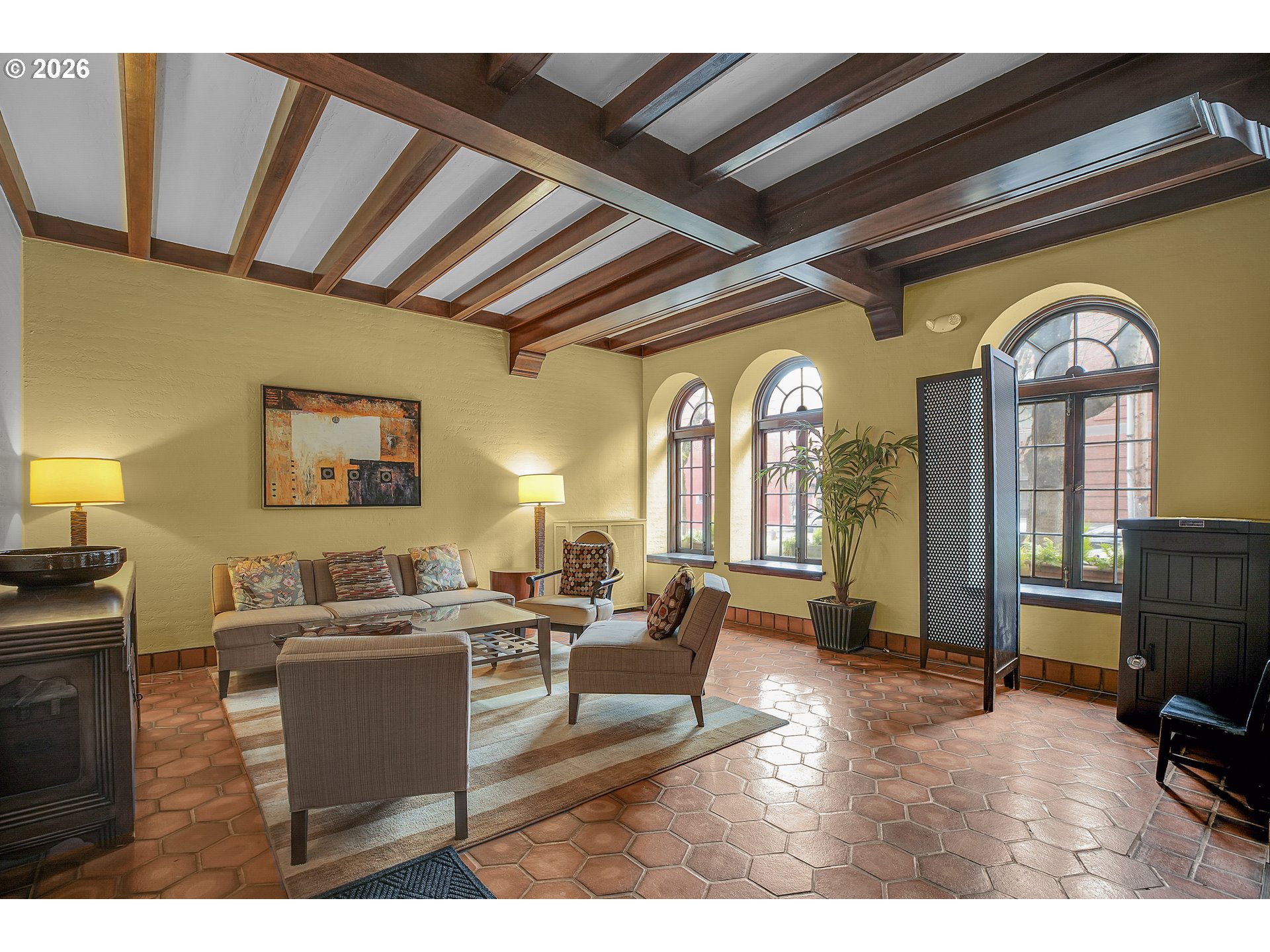 709 Southwest 16th Avenue, Unit 207 Portland, OR 97205 - Photo 8 of 47 a living room with furniture and a fireplace
