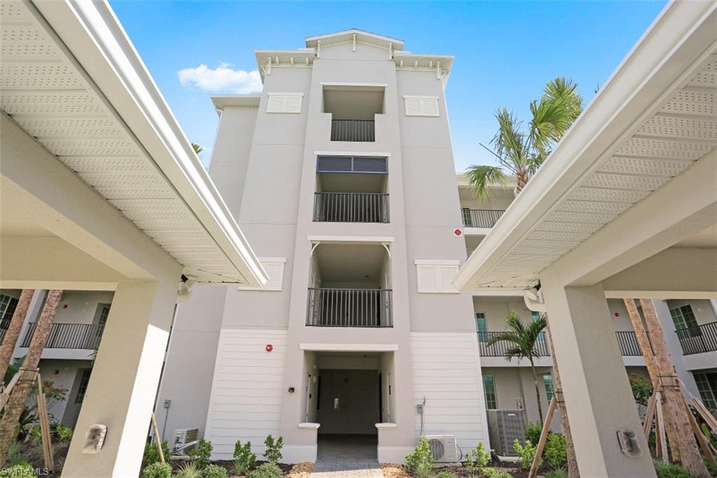 43010 Greenway Boulevard, Unit 234 Punta Gorda, FL 33982 - Photo 18 of 22 a front view of a house with plants