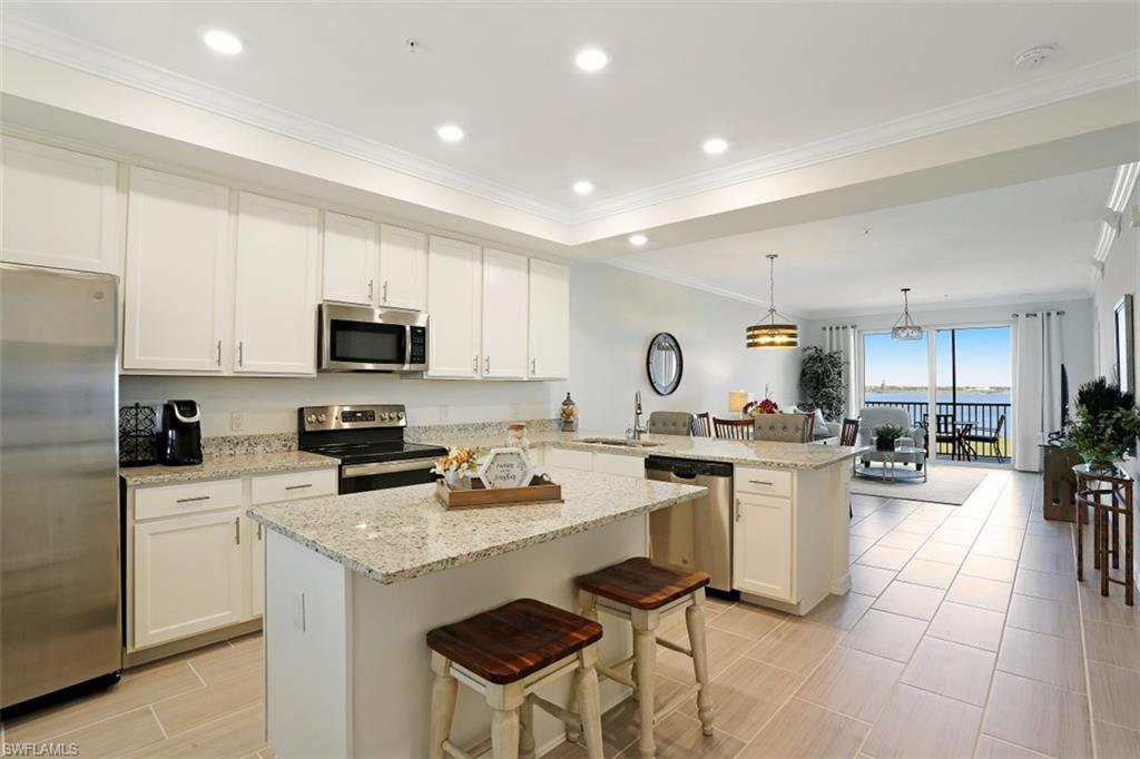 43010 Greenway Boulevard, Unit 234 Punta Gorda, FL 33982 - Photo 7 of 22 a kitchen with a sink a stove cabinets and counter space