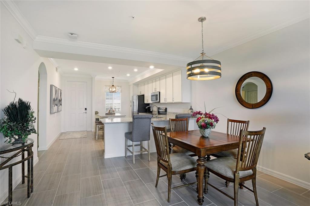 43010 Greenway Boulevard, Unit 234 Punta Gorda, FL 33982 - Photo 8 of 22 a view of a dining room and chairs in a room