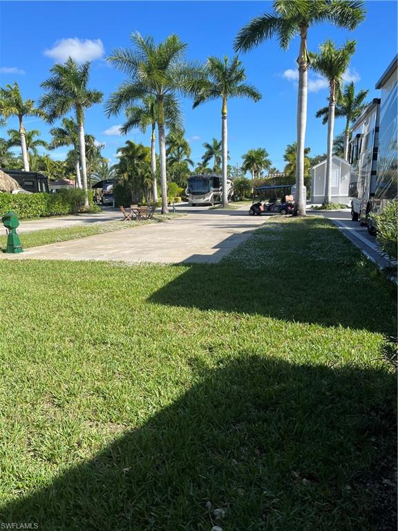 13601 Snapper Lane Naples, FL 34114 - Photo 3 of 3 a view of a park and palm trees