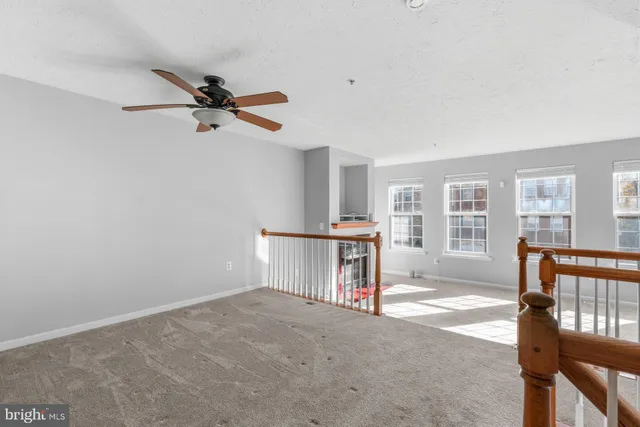 a view of a livingroom with furniture and a window
