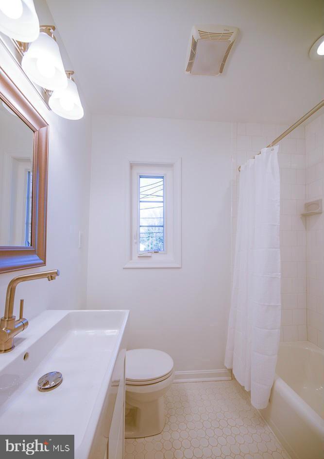 2503 Holman Avenue Silver Spring, MD 20910 - Photo 12 of 15 a bathroom with a sink a toilet and a tub