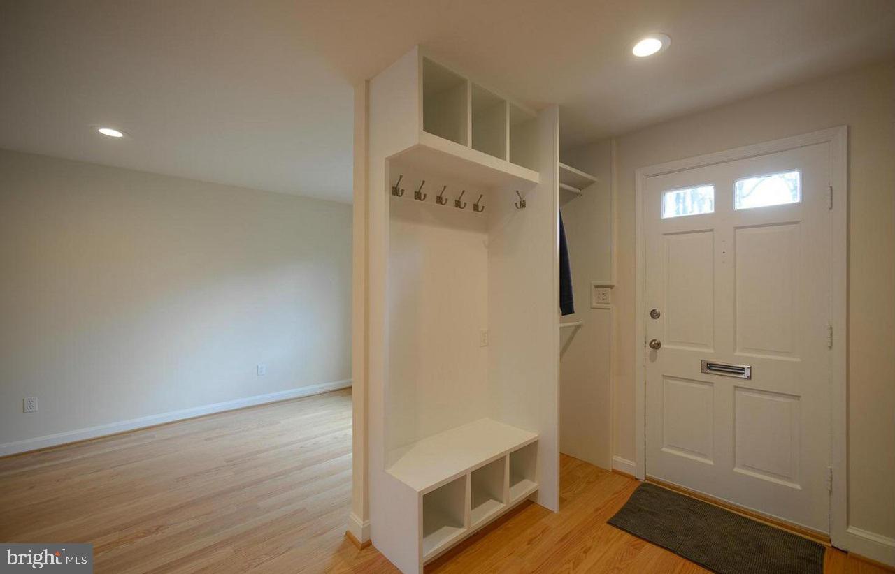 2503 Holman Avenue Silver Spring, MD 20910 - Photo 2 of 15 a view of a hallway with wooden floor and staircase