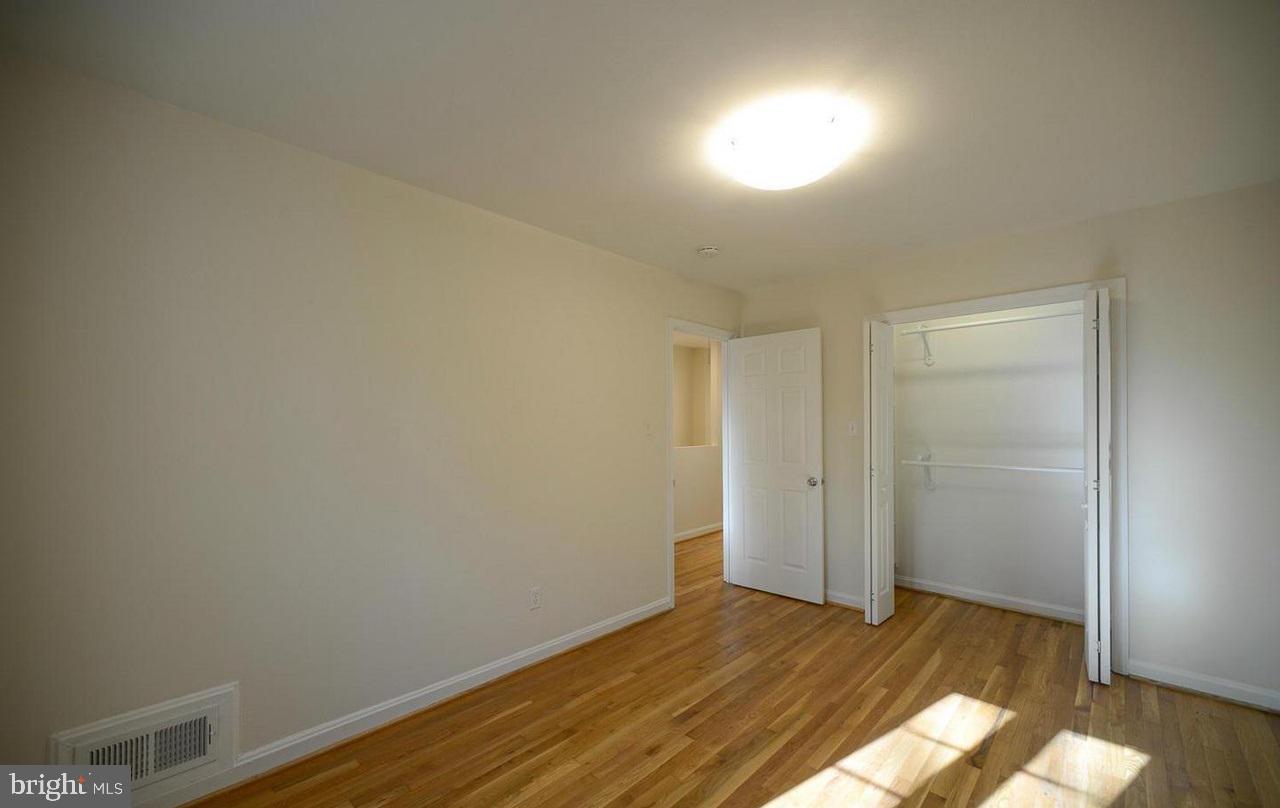 2503 Holman Avenue Silver Spring, MD 20910 - Photo 9 of 15 a view of empty room with wooden floor
