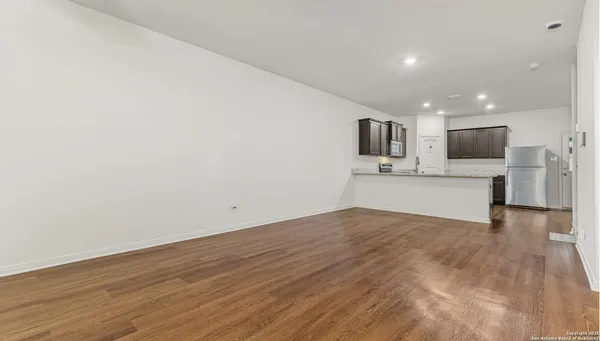 a view of a kitchen with a sink and a microwave