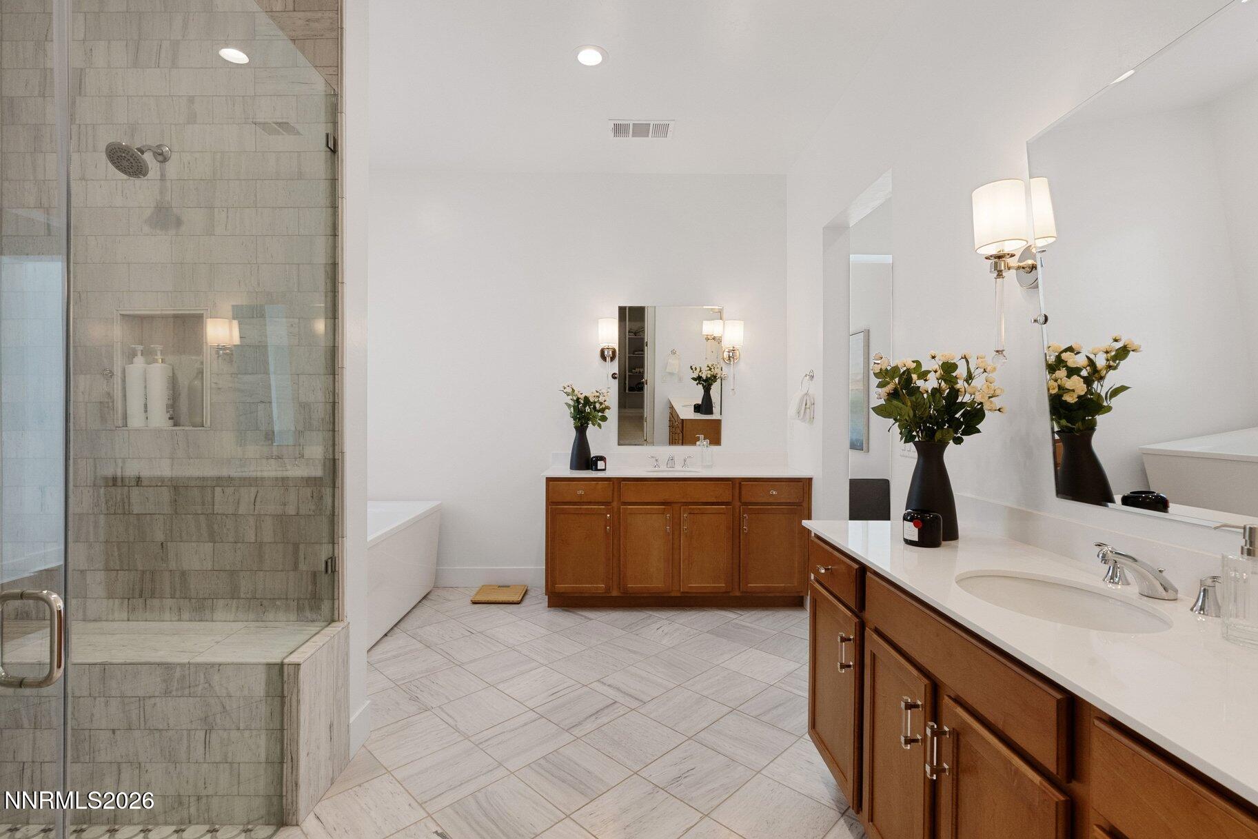 6110 South Pleasant Oak Trail Reno, NV 89511 - Photo 21 of 66 a bathroom with a double vanity sink mirror and shower