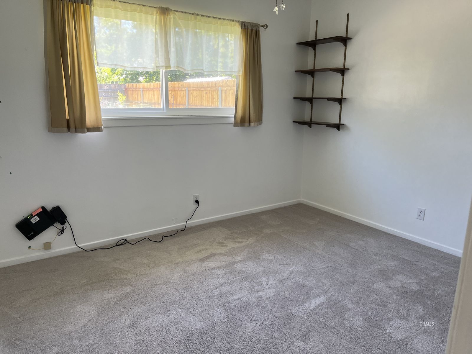 3012 Mesquite Road Bishop, CA 93514 - Photo 18 of 26 an empty room with windows and natural light