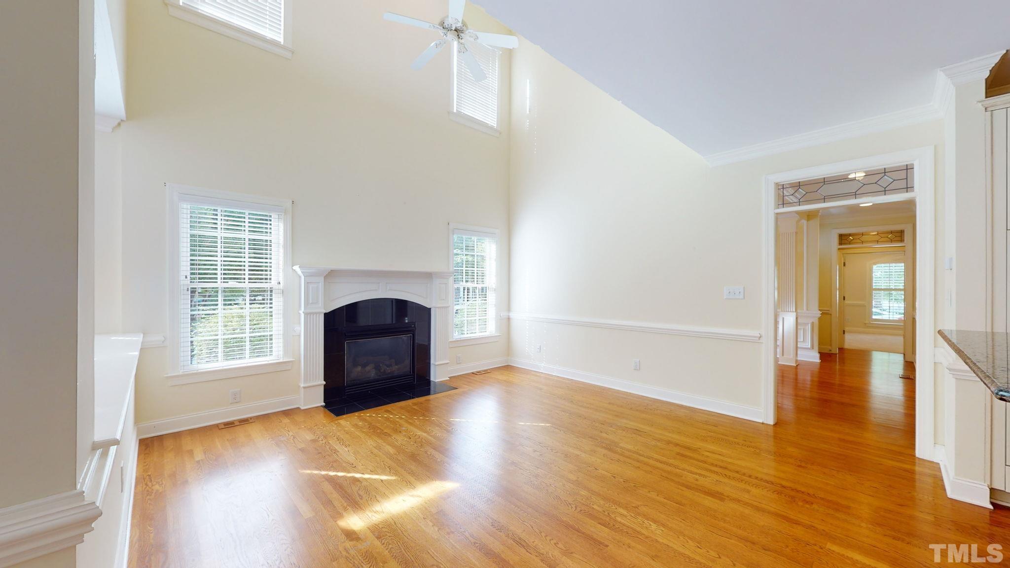 1931 Hornbeck Court Raleigh, NC 27614 - Photo 8 of 31 a view of empty room with wooden floor and fan