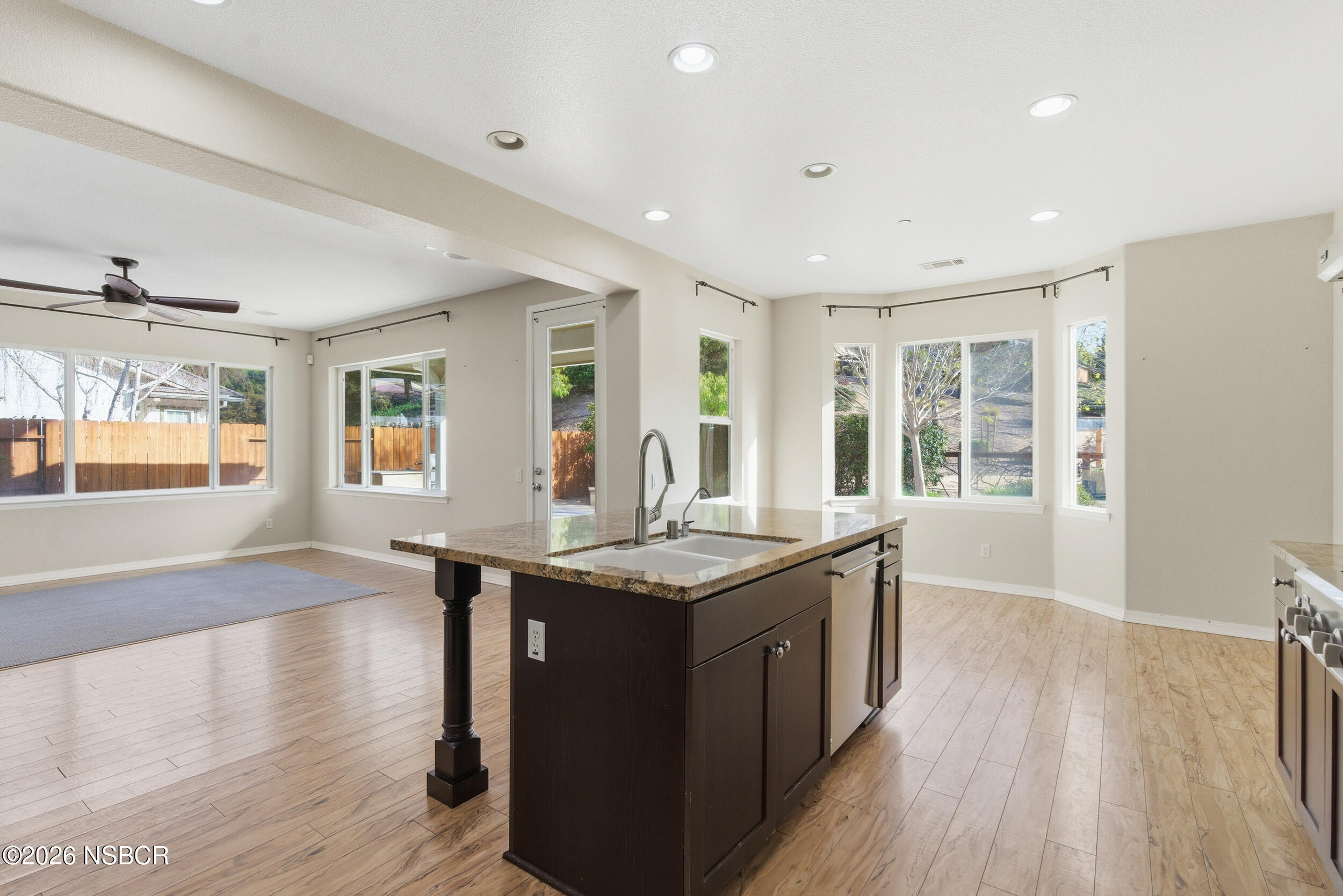 5632 Menemsha Lane Santa Maria, CA 93455 - Photo 10 of 66 a kitchen with stainless steel appliances granite countertop a stove and a wooden floors