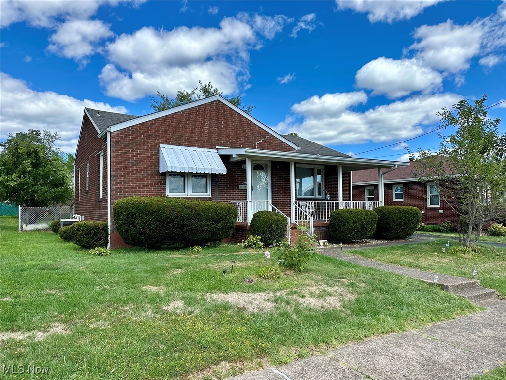 343 Raleigh Avenue Weirton, WV 26062 - Photo 2 of 46 View of front facade with a porch and a front yard