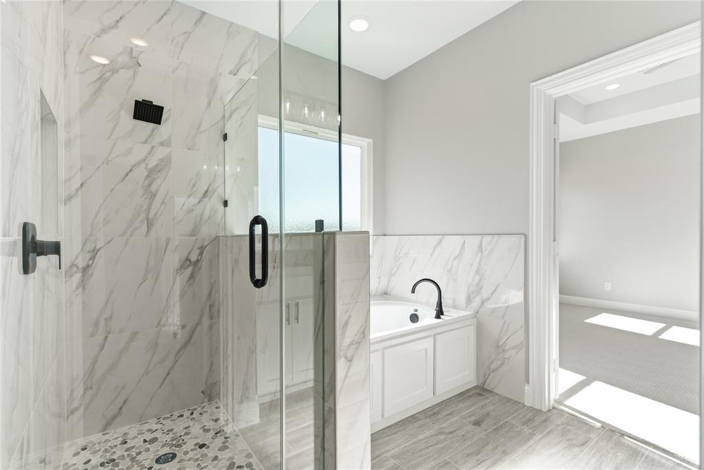 420 Ball Street Tom Bean, TX 75491 - Photo 16 of 34 a bathroom with a sink a mirror and shower