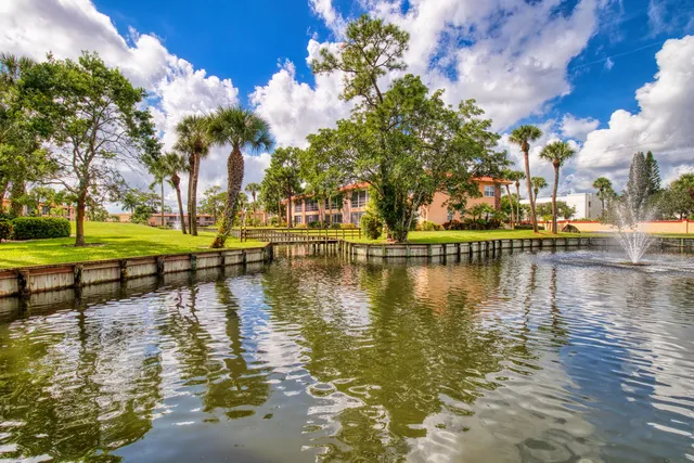 a garden view with a lake view