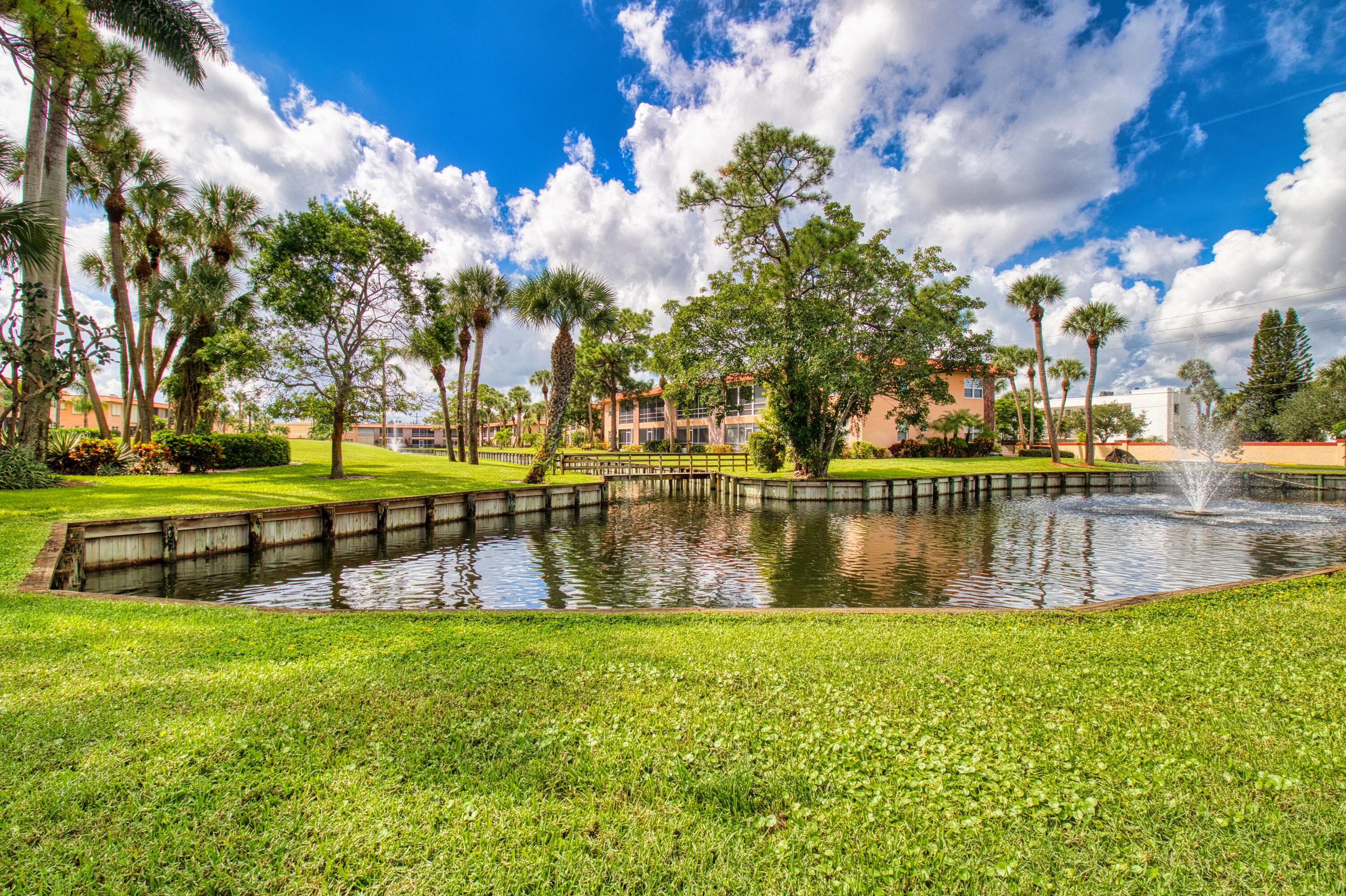 1911 Southwest Palm City Road, Unit J Stuart, FL 34994 - Photo 13 of 21 a garden view with a lake view