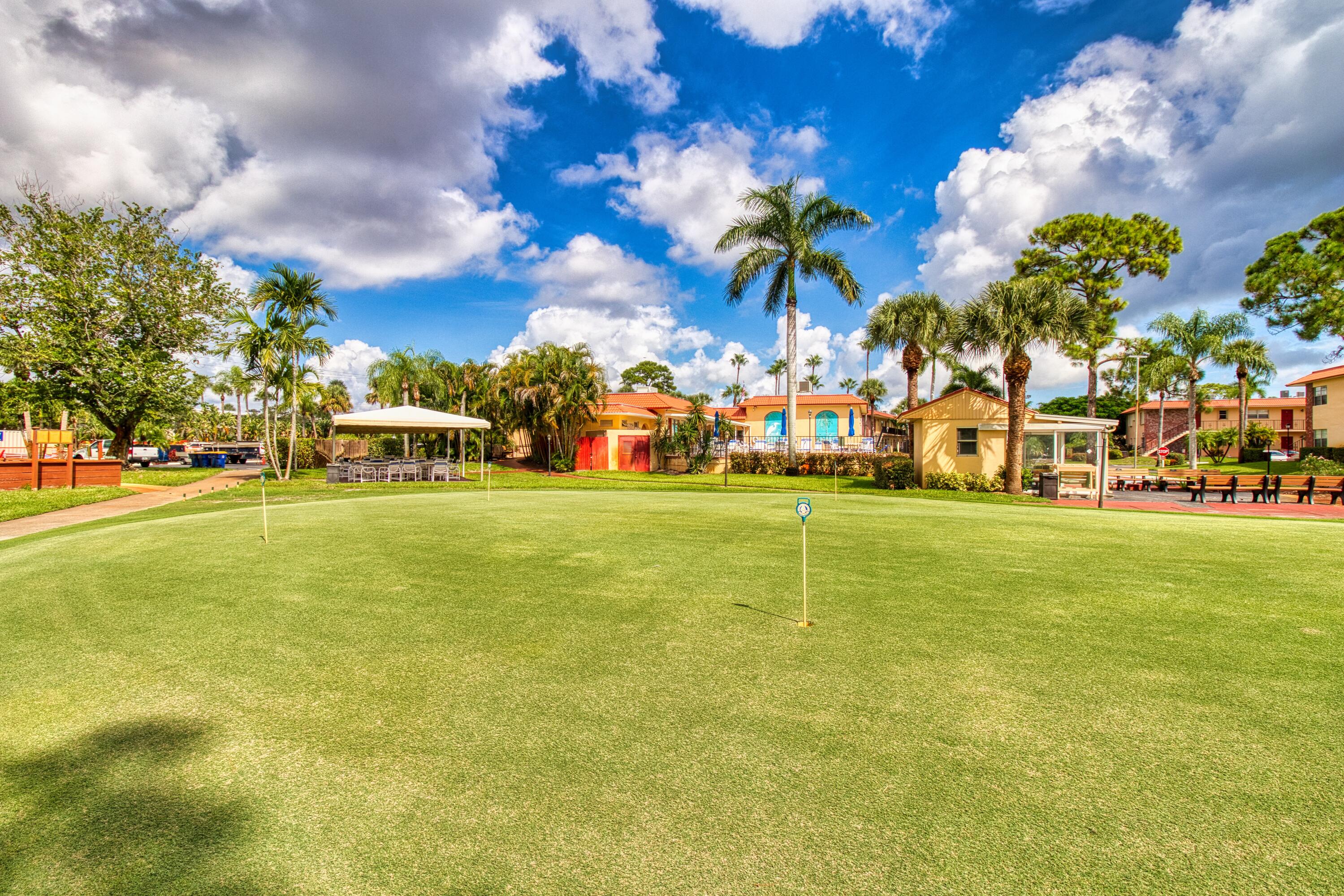 1911 Southwest Palm City Road, Unit J Stuart, FL 34994 - Photo 14 of 21 a view of a playground with basketball court