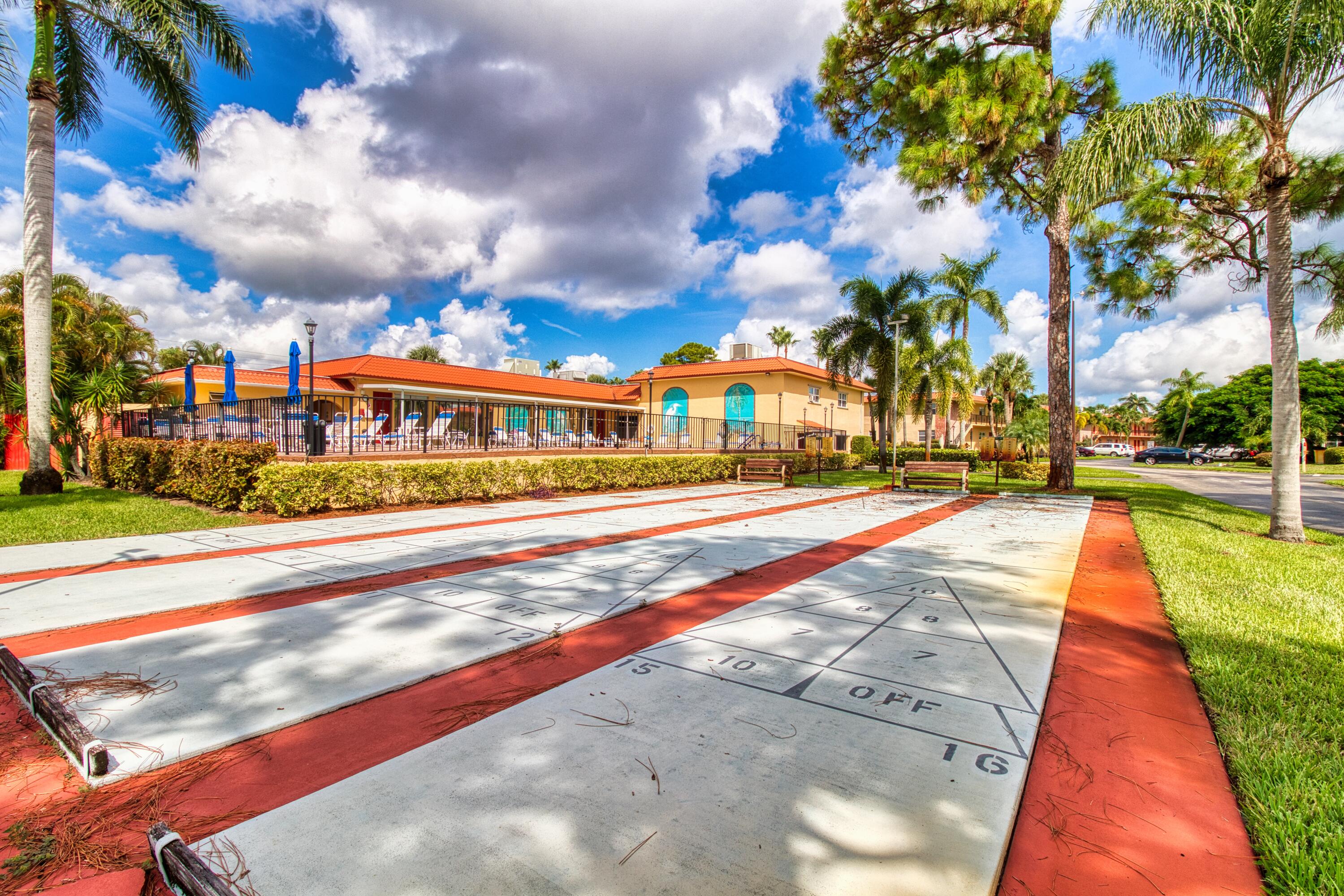 1911 Southwest Palm City Road, Unit J Stuart, FL 34994 - Photo 16 of 21 a view of swimming pool with outdoor seating