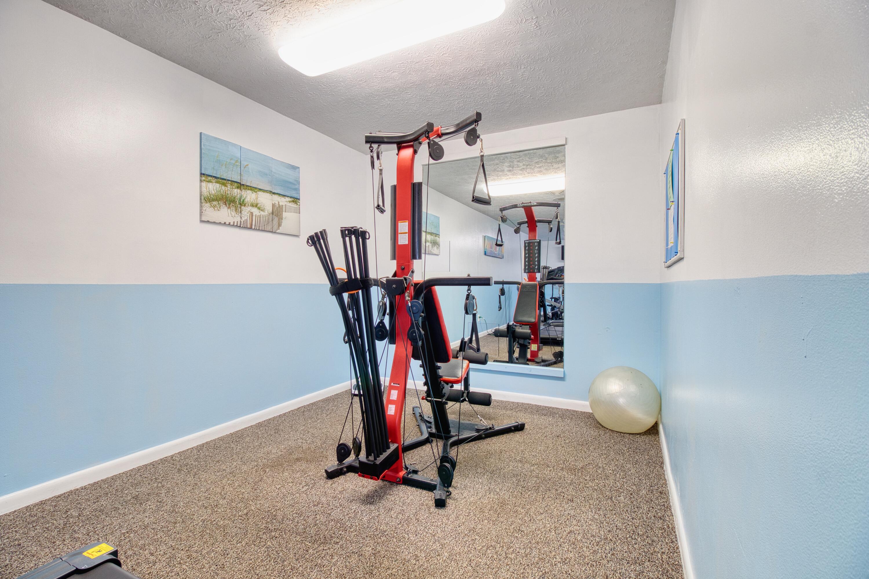 1911 Southwest Palm City Road, Unit J Stuart, FL 34994 - Photo 17 of 21 a view of a room with gym equipment