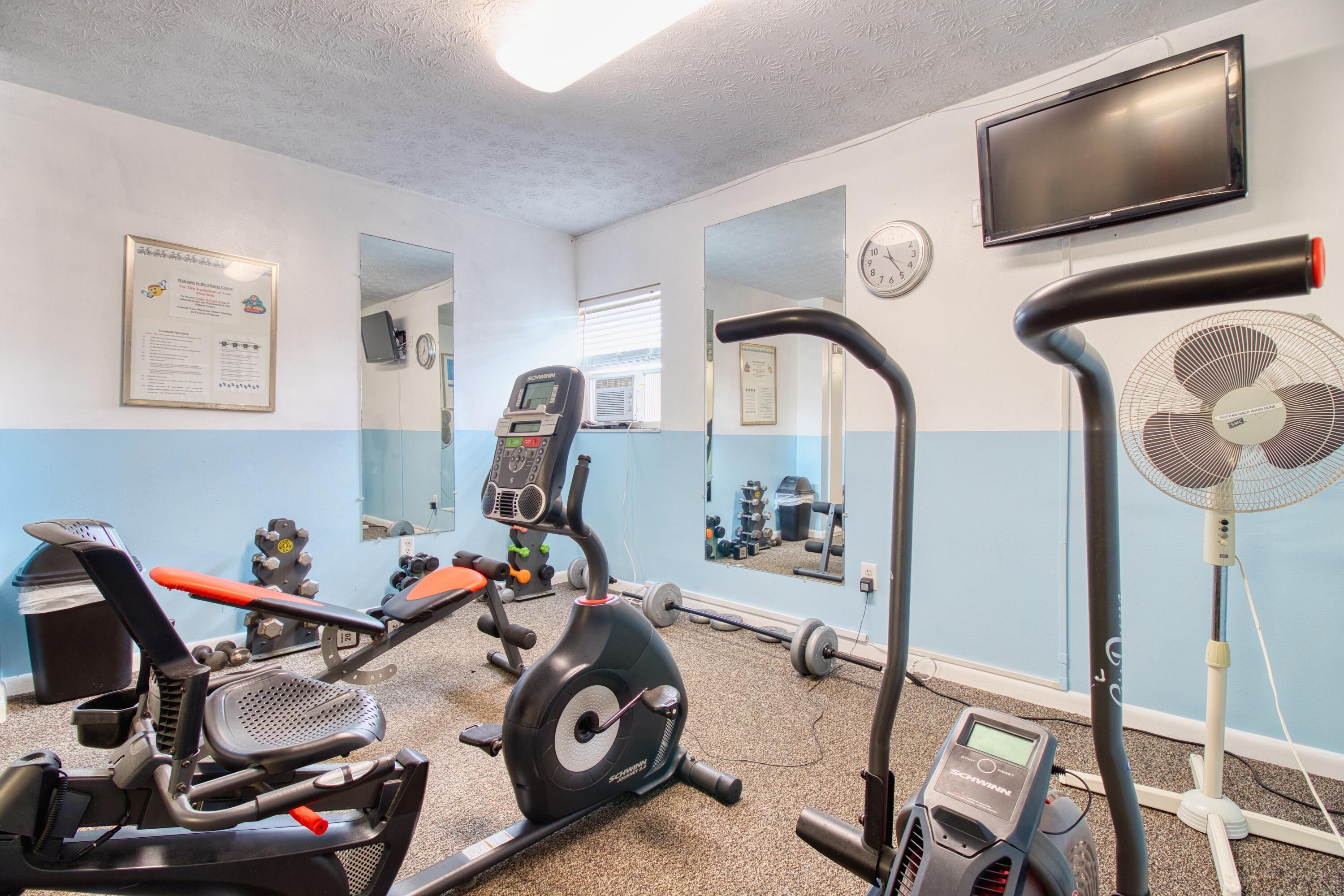 1911 Southwest Palm City Road, Unit J Stuart, FL 34994 - Photo 18 of 21 a view of a room with gym equipment