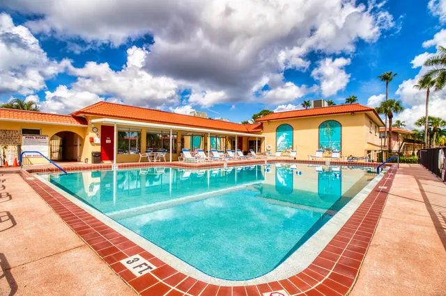 a view of a patio with swimming pool