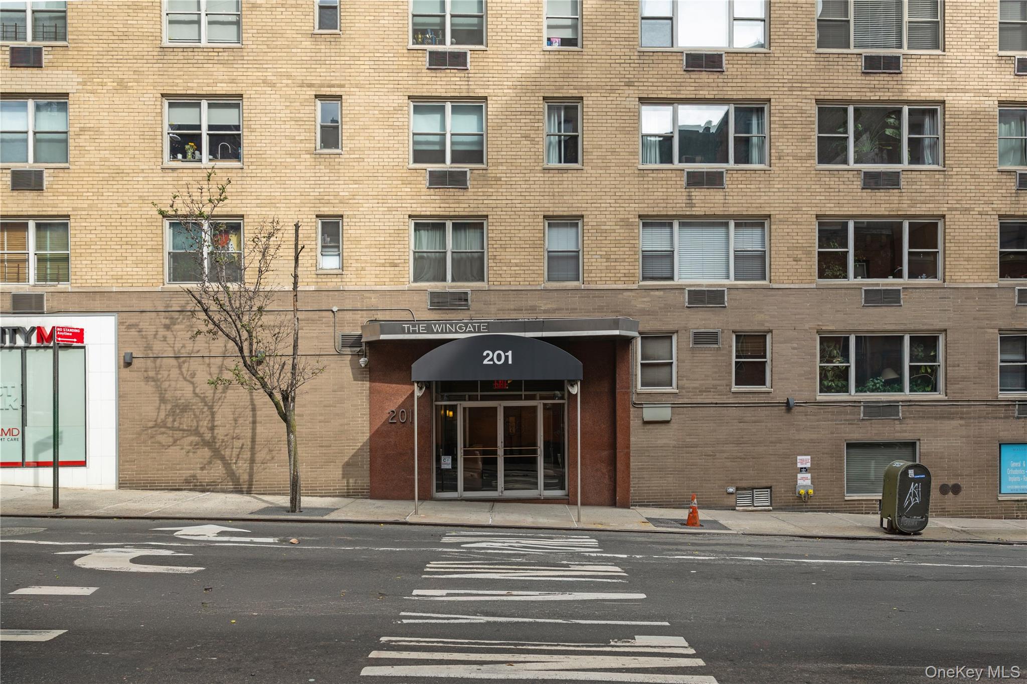 201 East 37th Street, Unit 7D Manhattan, NY 10016 - Photo 8 of 11 a front view of a building with lot of windows