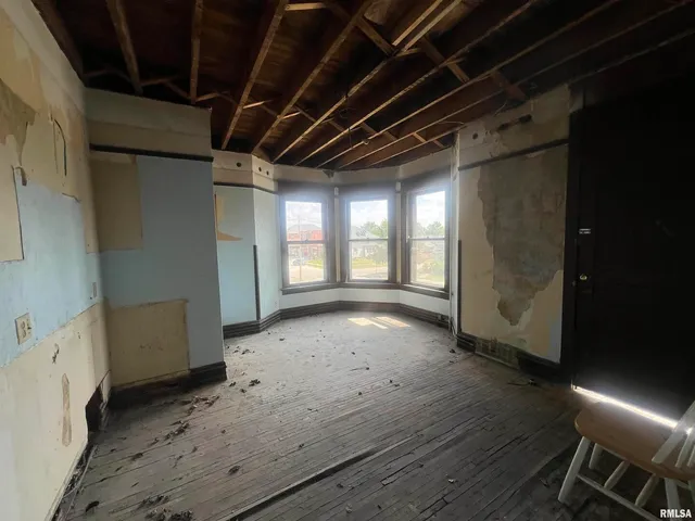 a view of hallway with wooden floor