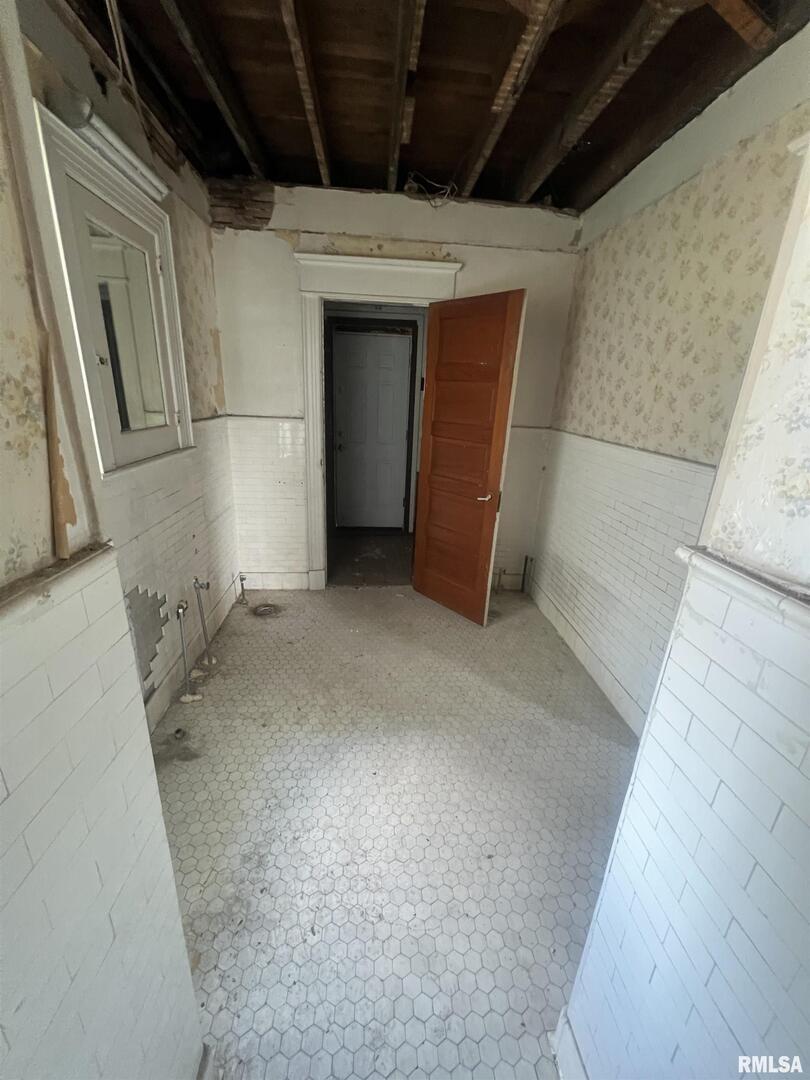 2220 Roosevelt Street Clinton, IA 52732 - Photo 15 of 18 a view of empty room with wooden floor