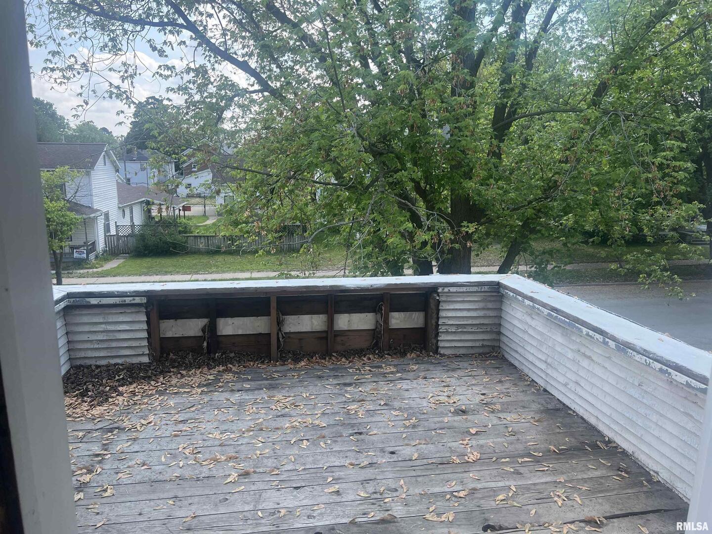 2220 Roosevelt Street Clinton, IA 52732 - Photo 17 of 18 a view of a bench in a backyard