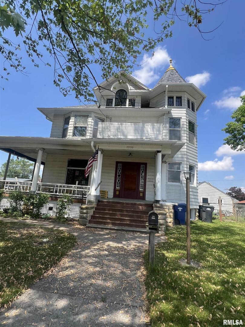 2220 Roosevelt Street Clinton, IA 52732 - Photo 2 of 18 a front view of a house with garden