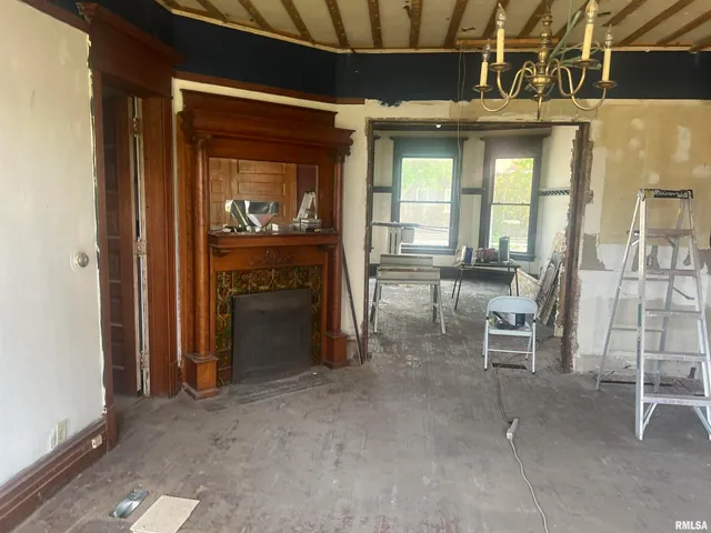 a view of a livingroom with furniture and a fireplace