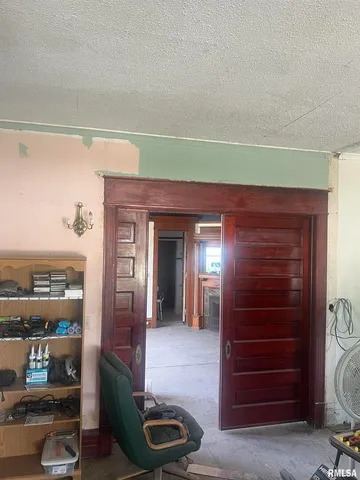 a living room with furniture and a closet