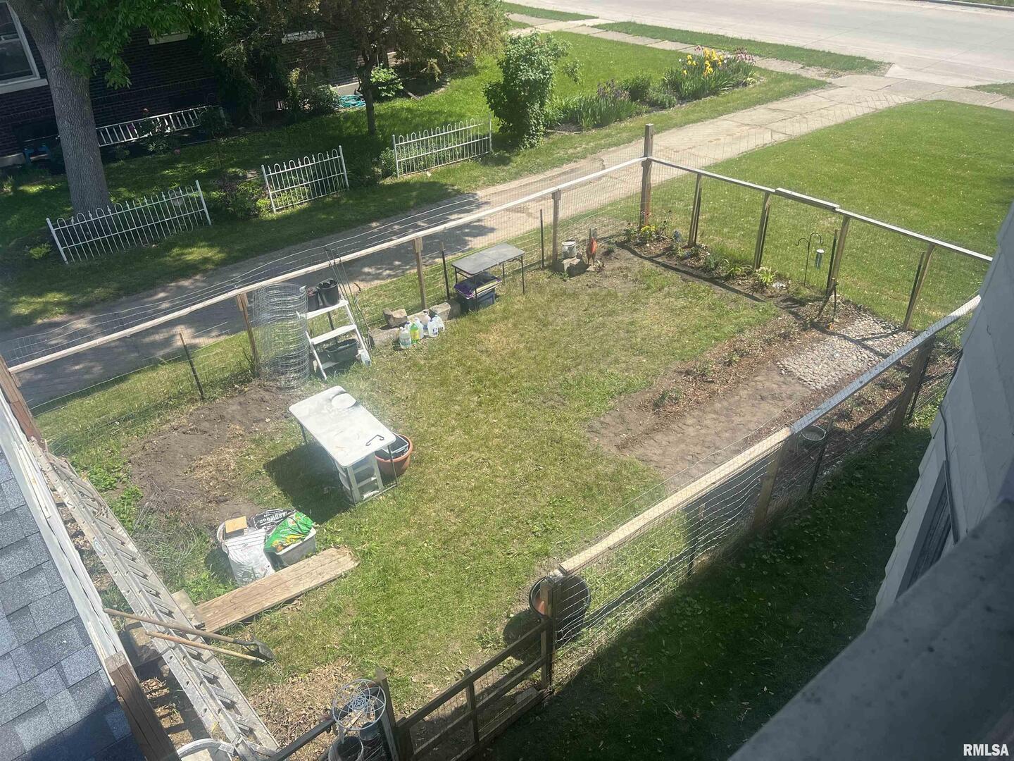 2220 Roosevelt Street Clinton, IA 52732 - Photo 10 of 18 a view of a wooden deck and living room