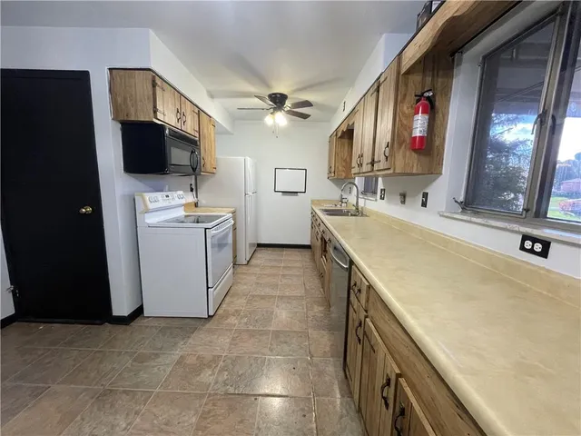 a kitchen with a stove and a microwave