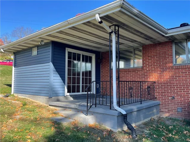 a swimming pool with some trees in the background