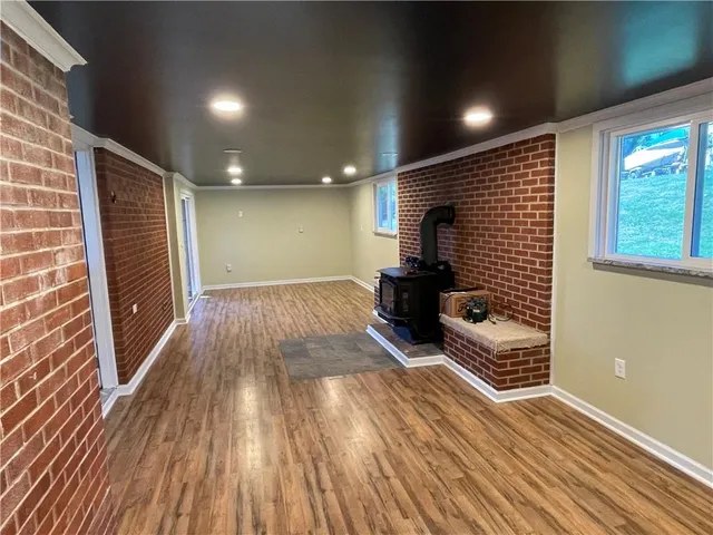 a lobby with furniture and wooden floor