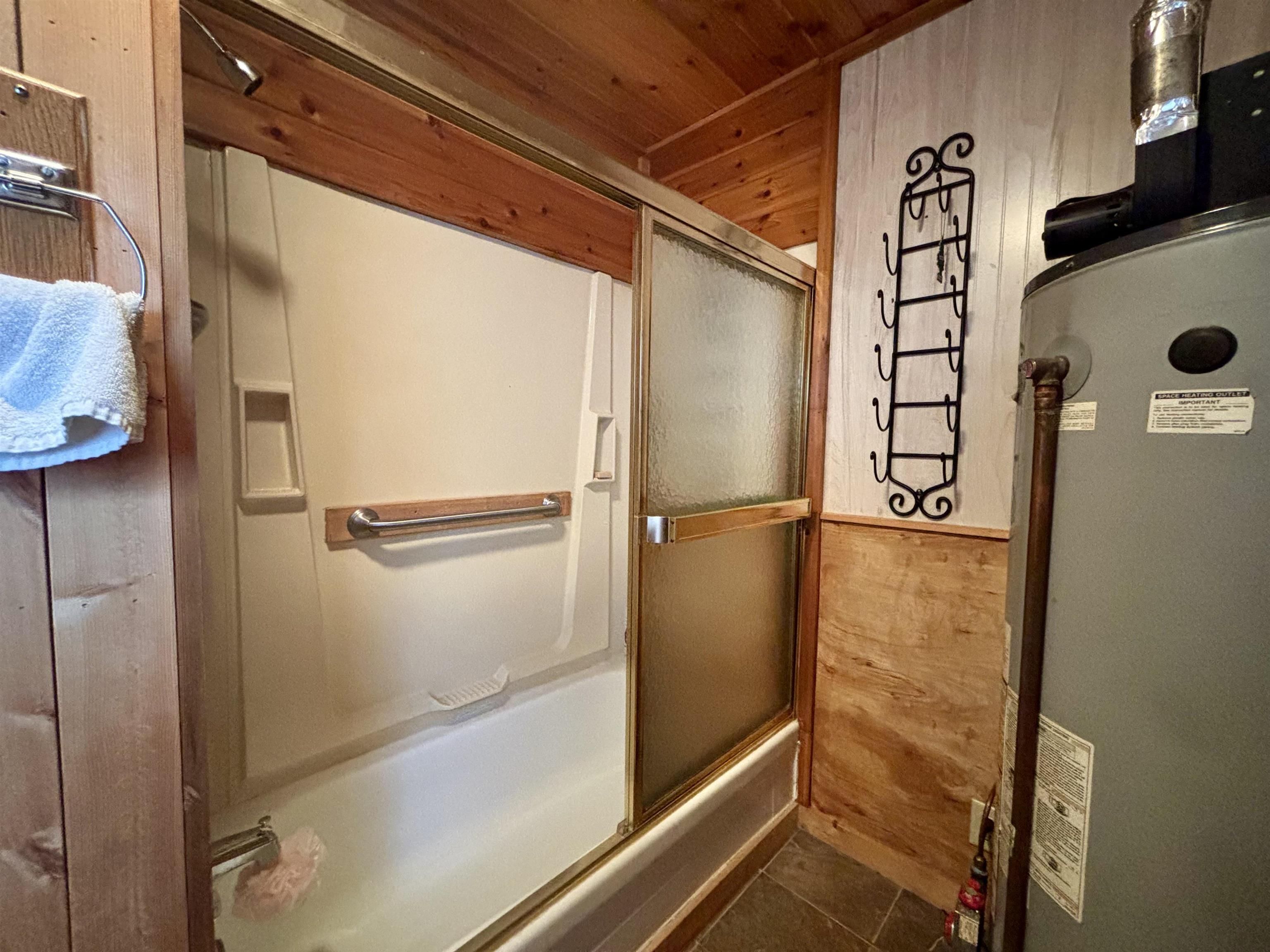 9724 State Highway 1 Isabella, MN 55607 - Photo 16 of 21 Bathroom with bath / shower combo with glass door, wooden ceiling, tile patterned flooring, and wooden walls