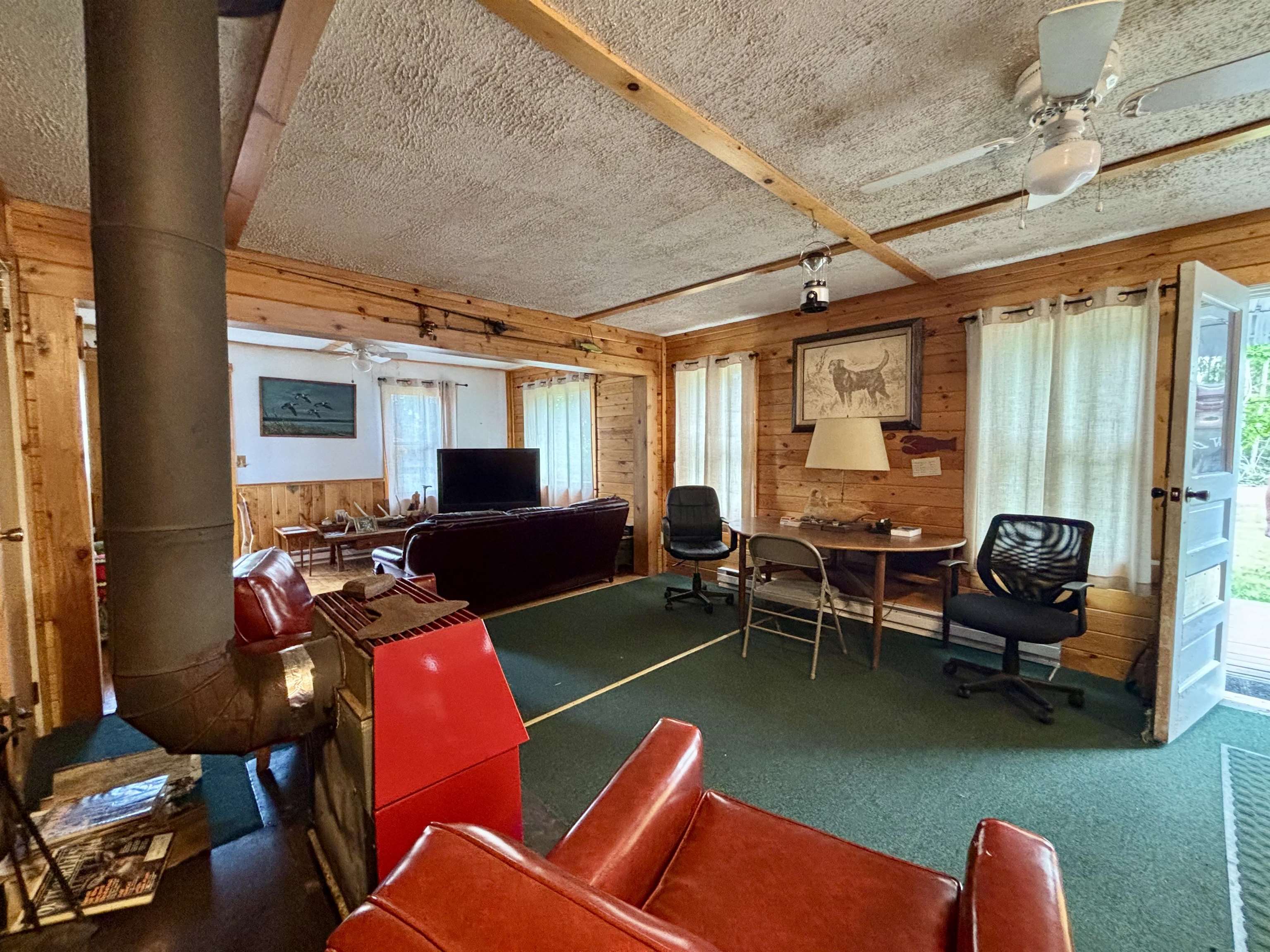 9724 State Highway 1 Isabella, MN 55607 - Photo 8 of 21 Carpeted office space with wooden walls and a ceiling fan