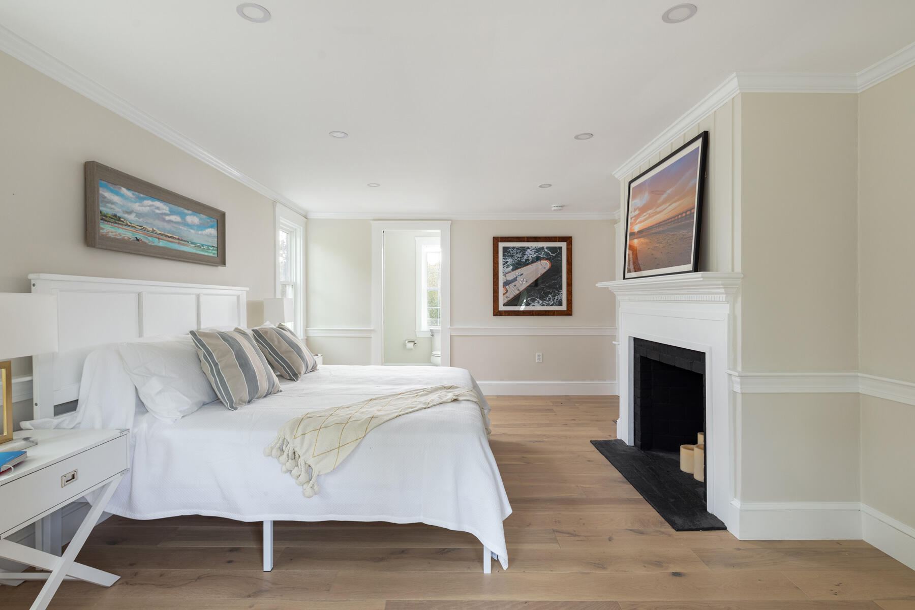 232 Tonset Road Orleans, MA 02653 - Photo 20 of 76 a bedroom with a bed and a fireplace