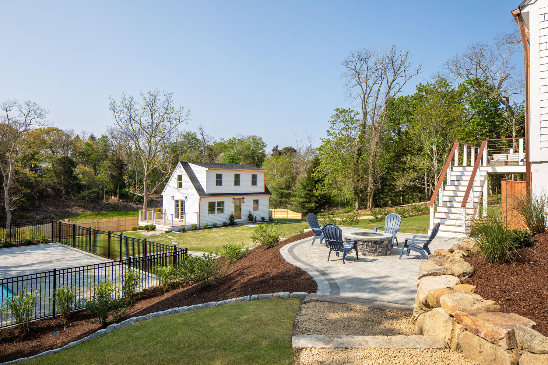 232 Tonset Road Orleans, MA 02653 - Photo 46 of 76 a view of a house with backyard patio and swimming pool