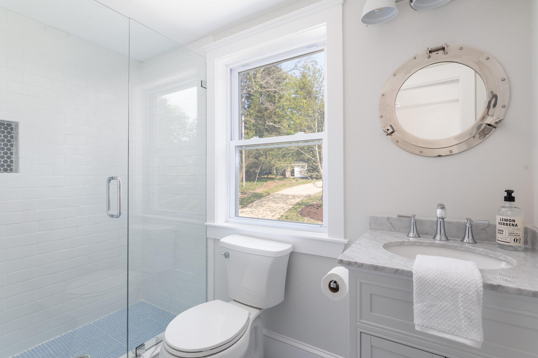 232 Tonset Road Orleans, MA 02653 - Photo 59 of 76 a bathroom with a sink a toilet and a mirror