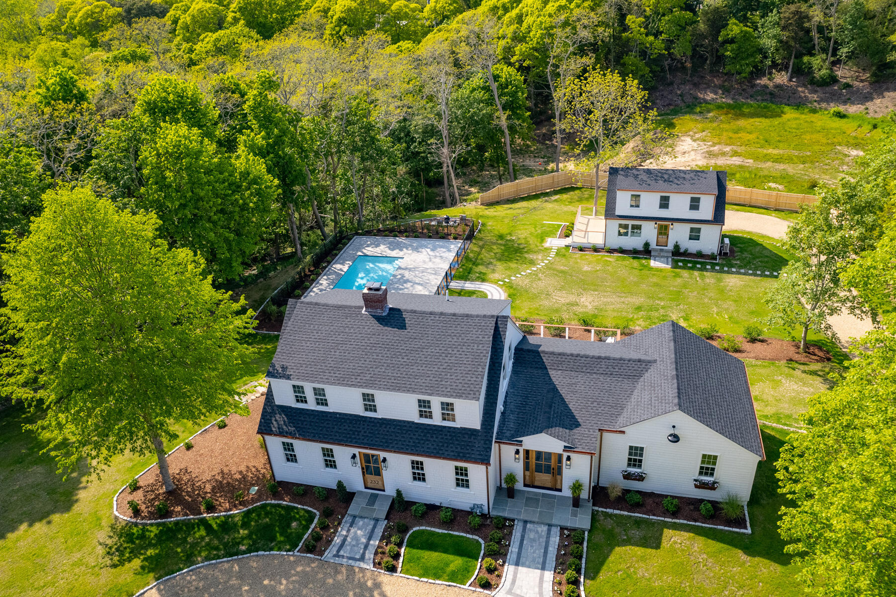 232 Tonset Road Orleans, MA 02653 - Photo 64 of 76 an aerial view of a house with swimming pool and large trees
