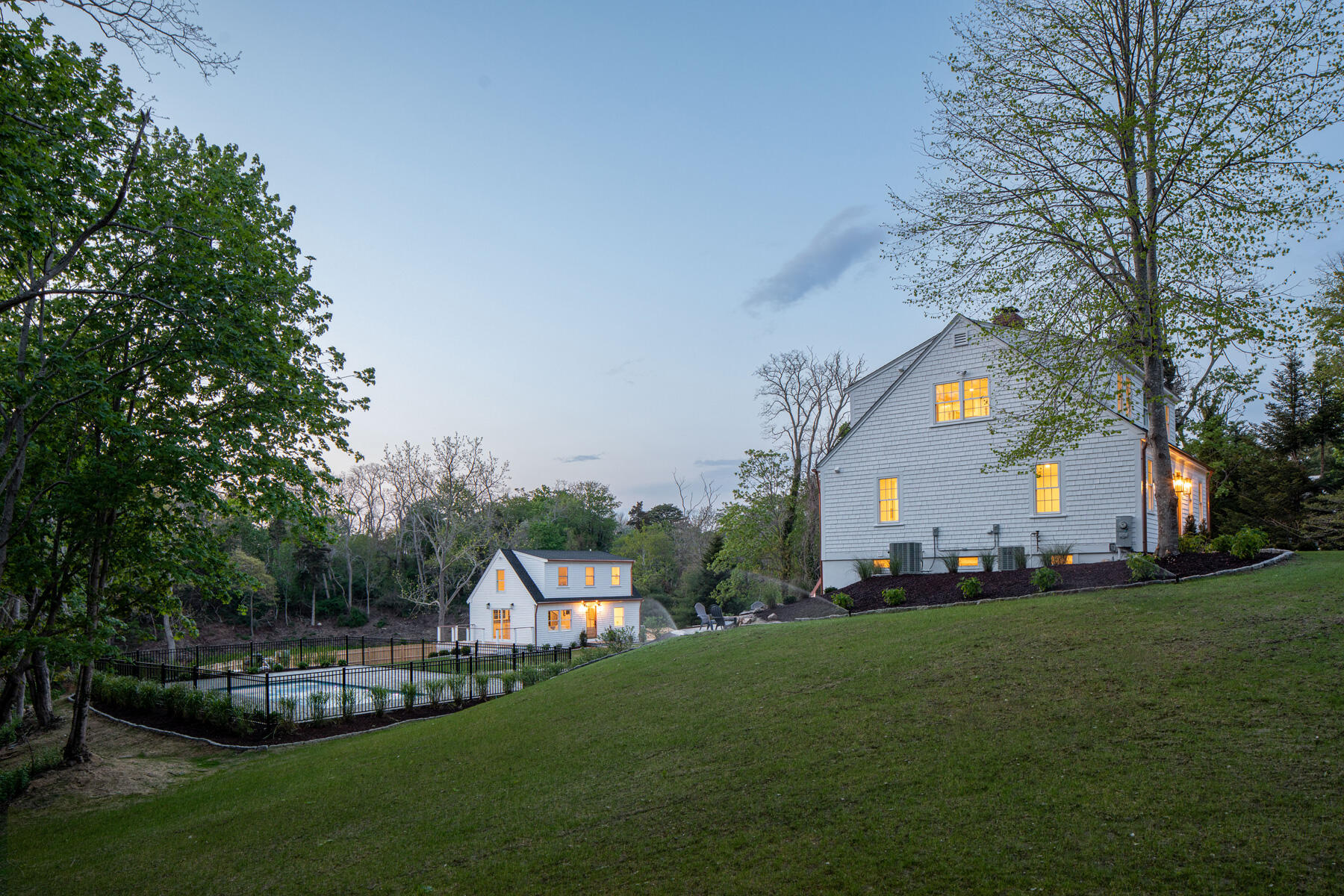 232 Tonset Road Orleans, MA 02653 - Photo 73 of 76 a front view of a house with a garden and trees