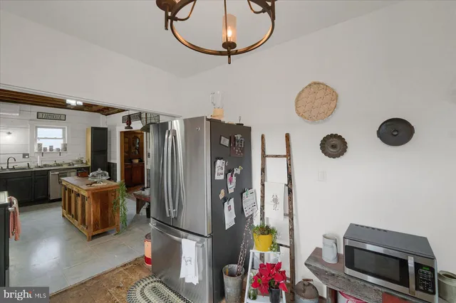 a view of a kitchen with workspace and a window