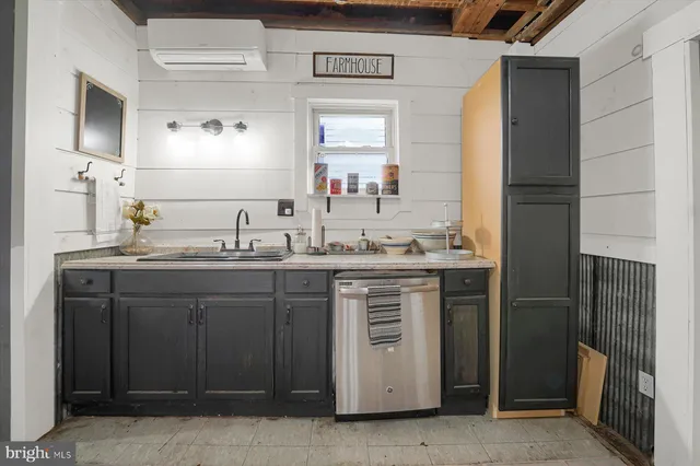 a bathroom with a sink double vanity and a mirror